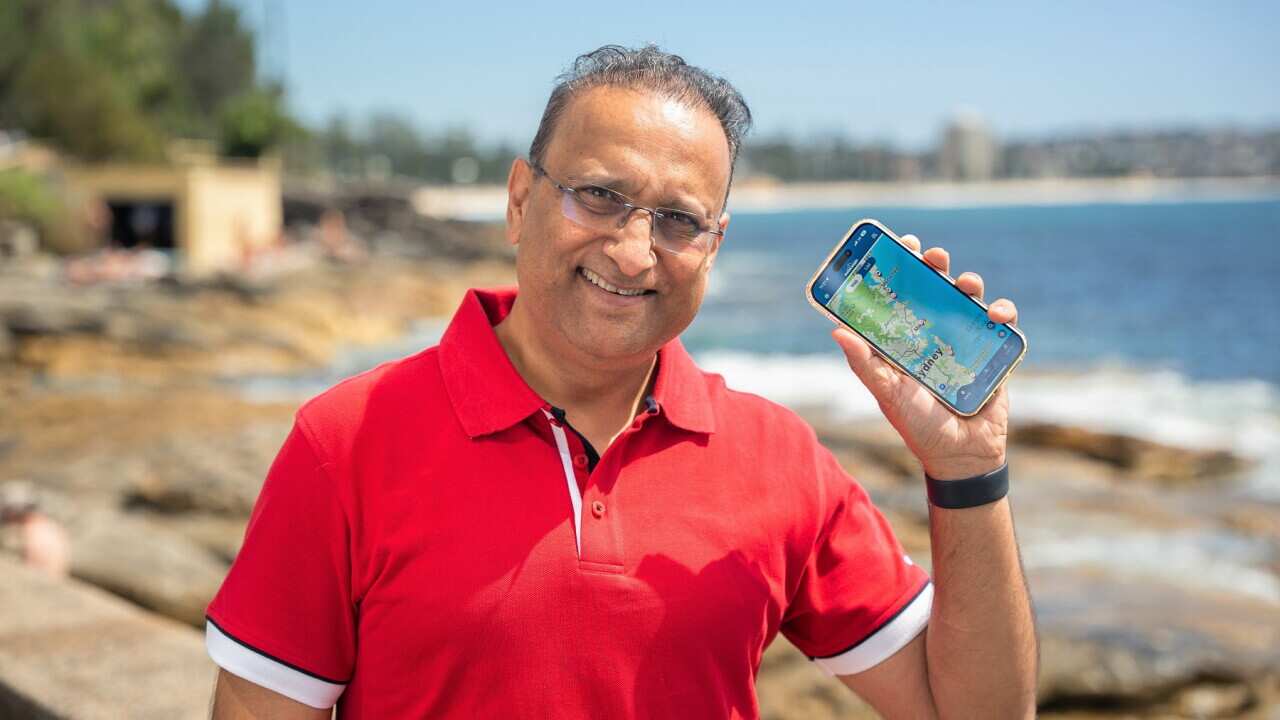 Mrudul Vasavada shows his SharkSmart app (Spencer Austad, SBS).jpg