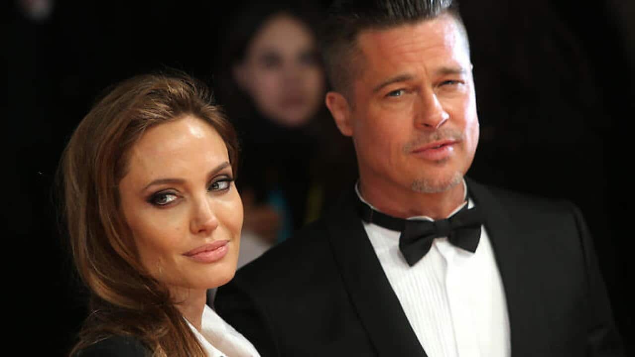 Actors Angelina Jolie and Brad PItt pose for photographers on the red carpet at the EE British Academy Film Awards held at the Royal Opera House on Sunday Feb. 16, 2014, in London. (Photo by Joel Ryan/Invision/AP)