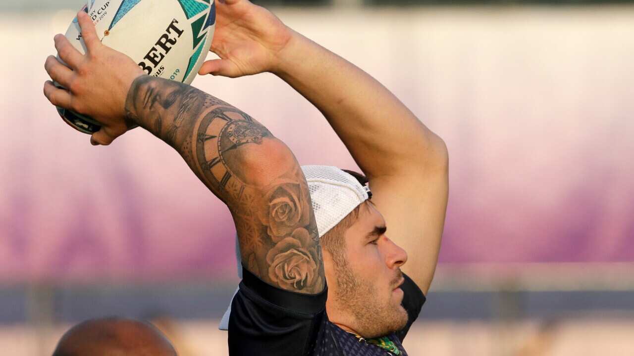 South Africa's Malcolm Marx throws a ball during a training session in Tokyo, Japan, Wednesday, Oct. 23, 2019. The Springboks play Wales in a Rugby World Cup semifinal in Yokohama on Sunday Oct. 27. (AP Photo/Mark Baker)
