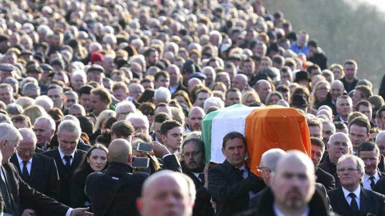 The coffin of former IRA commander and Sinn Fein deputy leader Martin McGuinness is carried to the cemetery in Londonderry, Northern Ireland