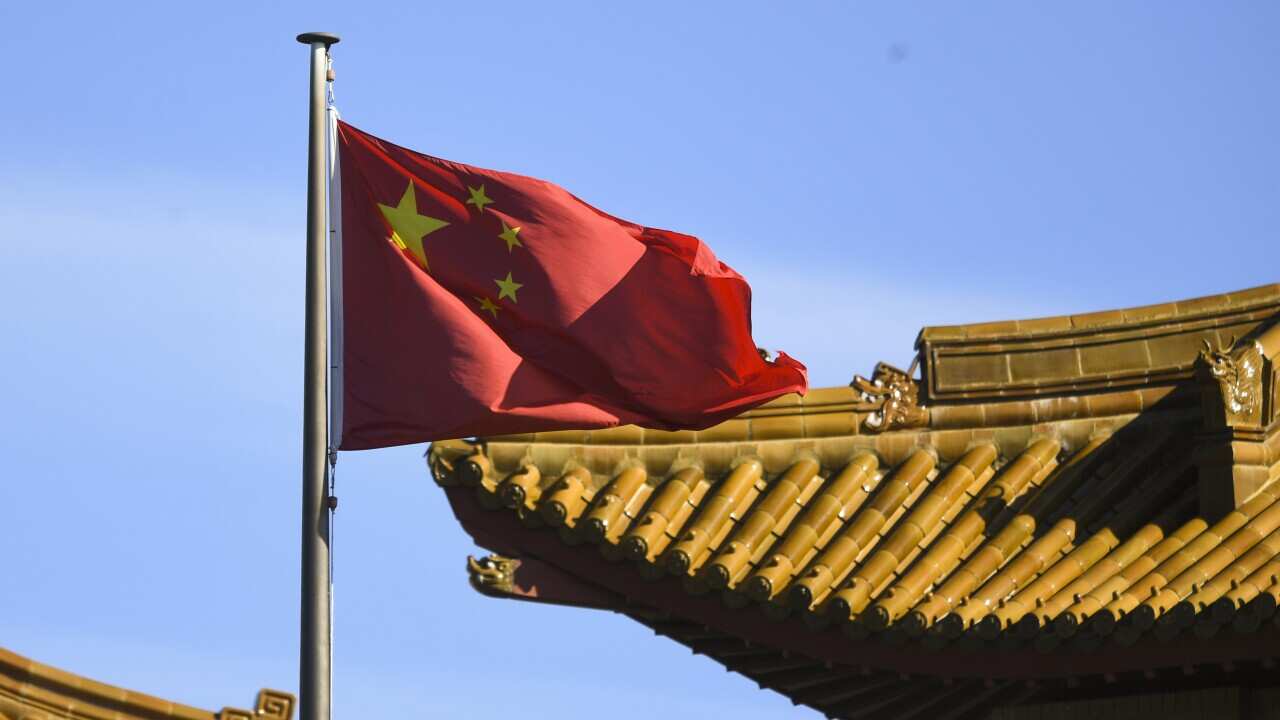 The Chinese flag flying at the country's embassy in Canberra.