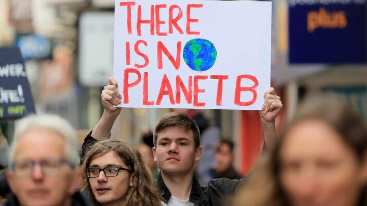 A young man protesting about climate change
