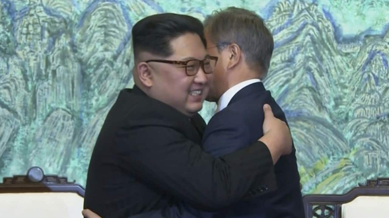 North Korean leader Kim Jong-un, left, and South Korean President Moon Jae-in embrace each other after signing a joint statement.