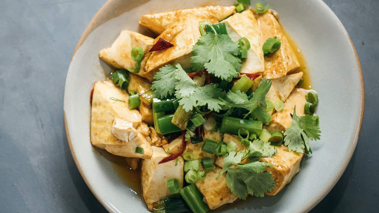 Fried tofu with spring onion and red chilli