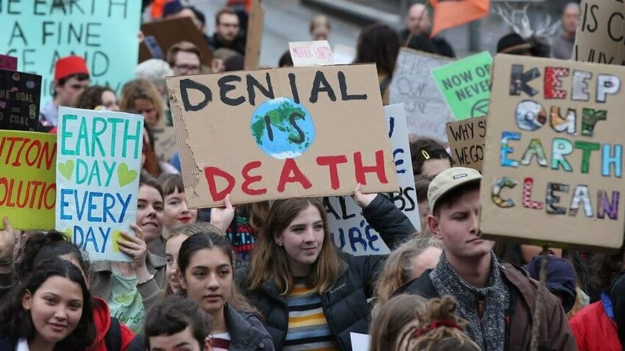Students in Melbourne march as part of the Global Climate Strike. Several Australian companies are urging workers to walk off the job as part of the next round.
