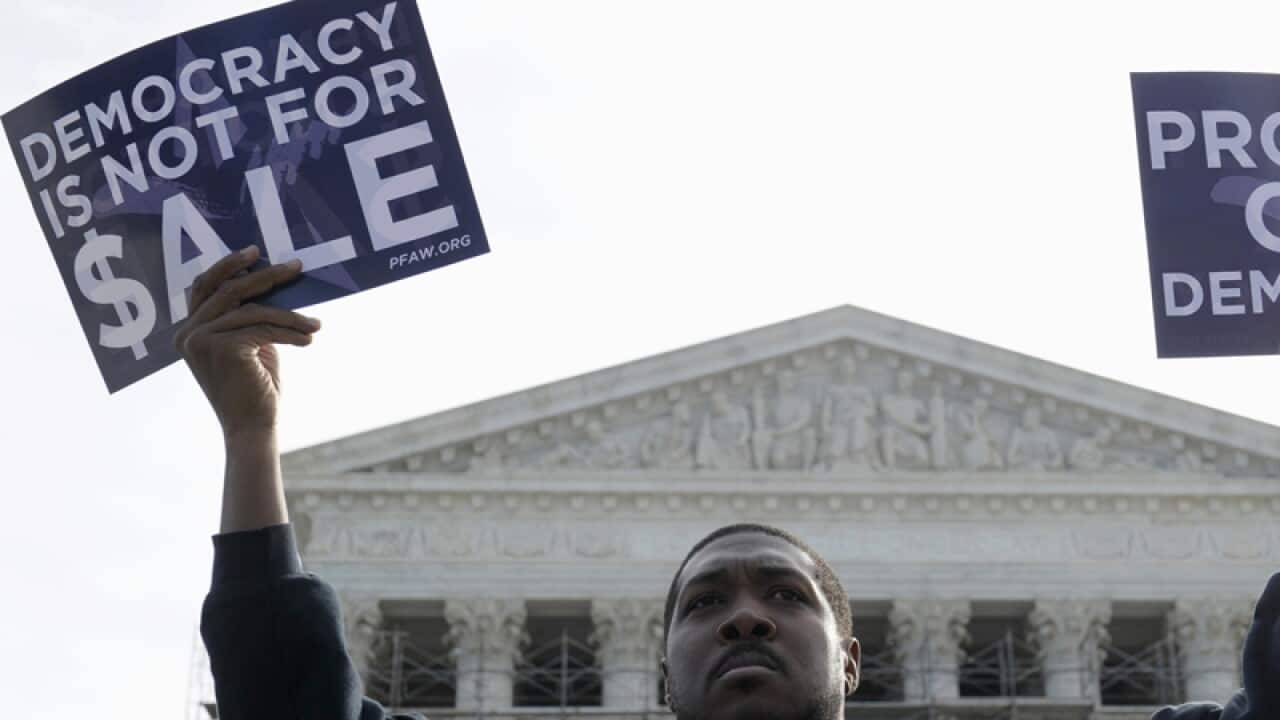 A man demonstrates against campaign finance outside the Supreme Court