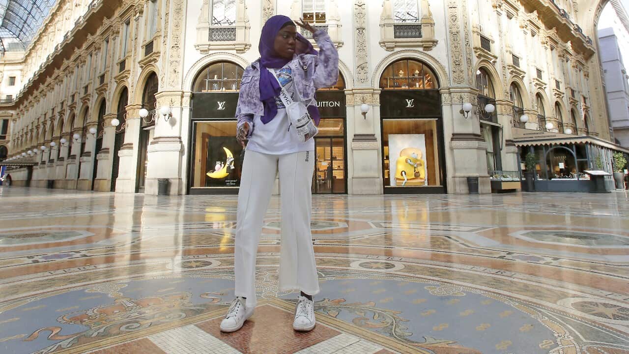 Aida Diouf Mbengue records a video for her TikTok account to share with her 330,000 followers in an empty Vittorio Emanuele gallery, Italy.