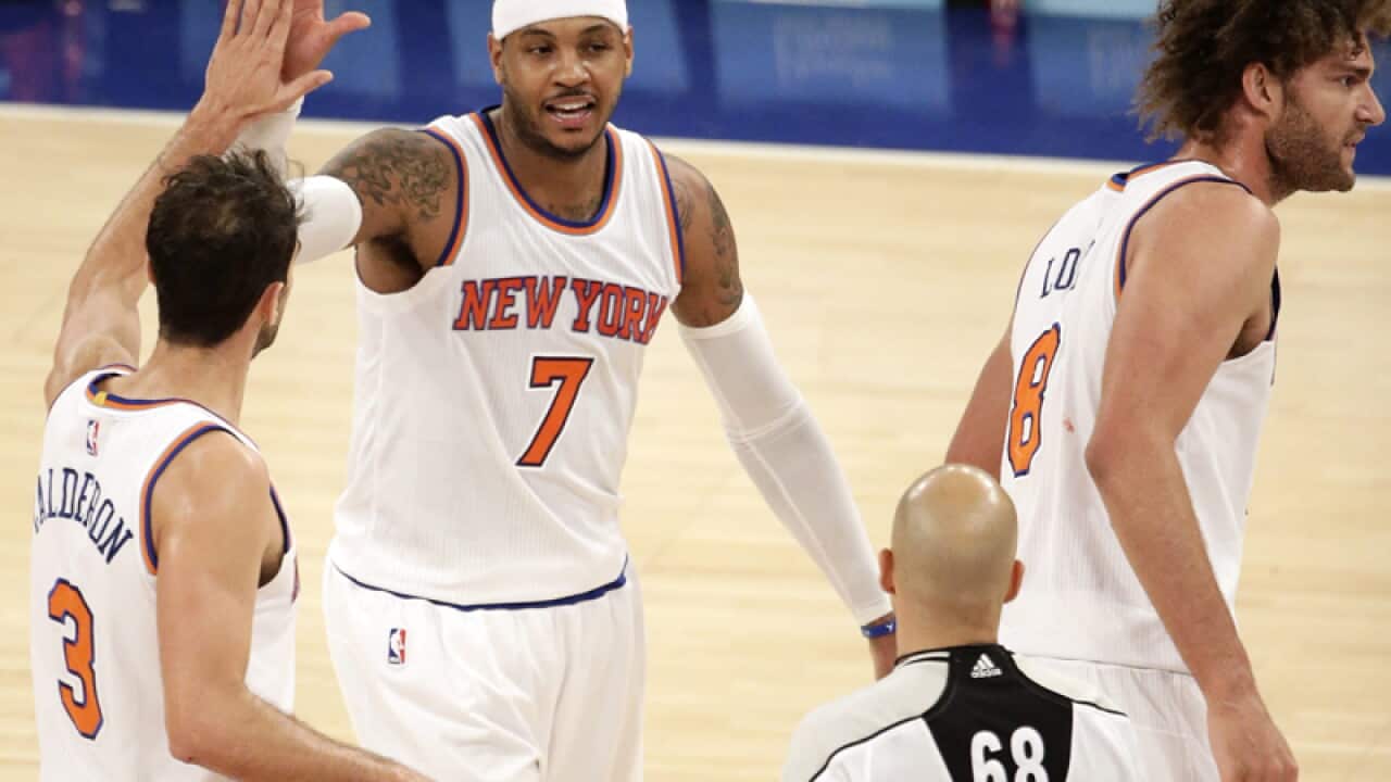 New York Knicks forward Carmelo Anthony (C) celebrates