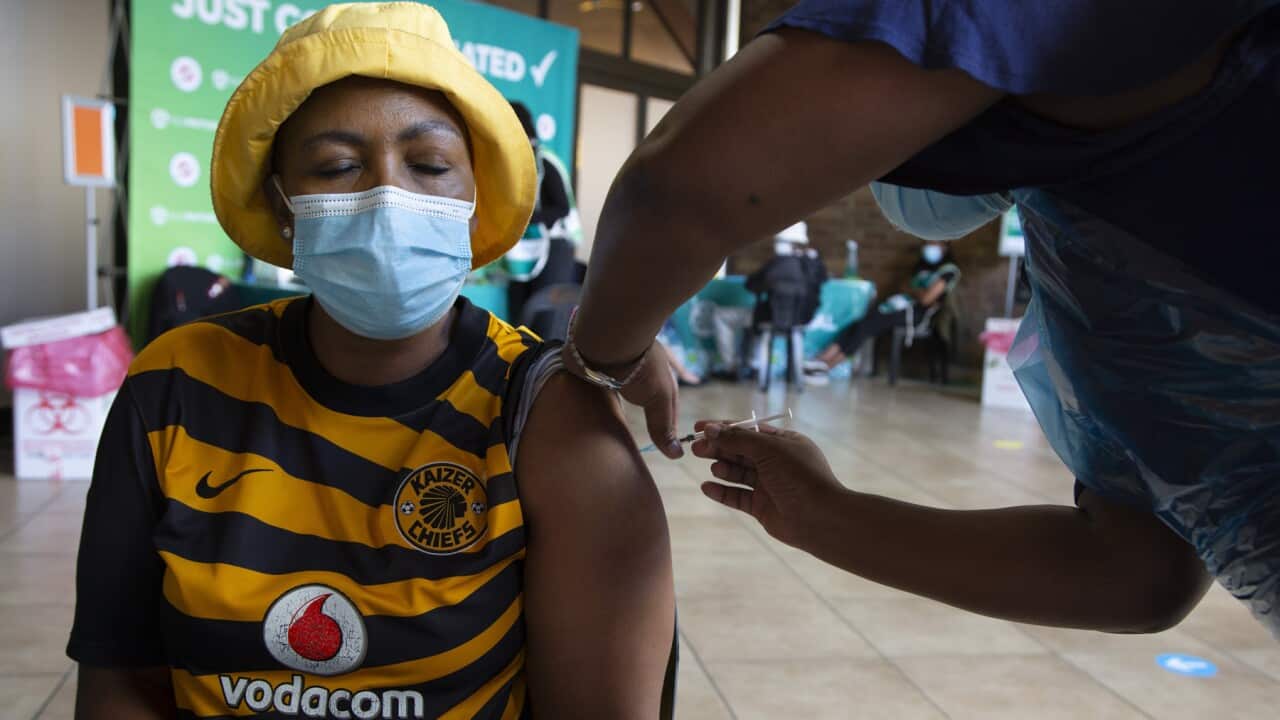 A woman receives a vaccine in South Africa (AAP)