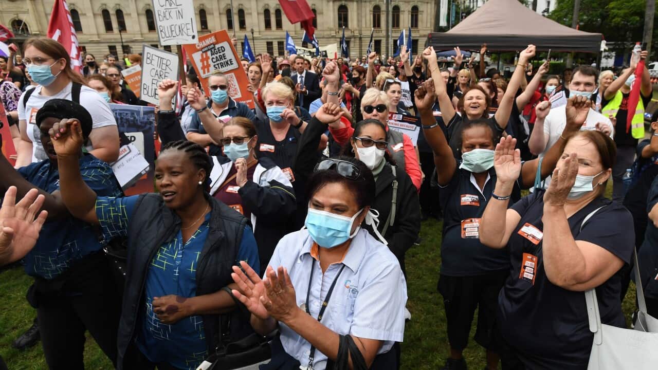 Protesters are seen during an aged care workers strike at Queen's Gardens Park in Brisbane on 10 May 2022.