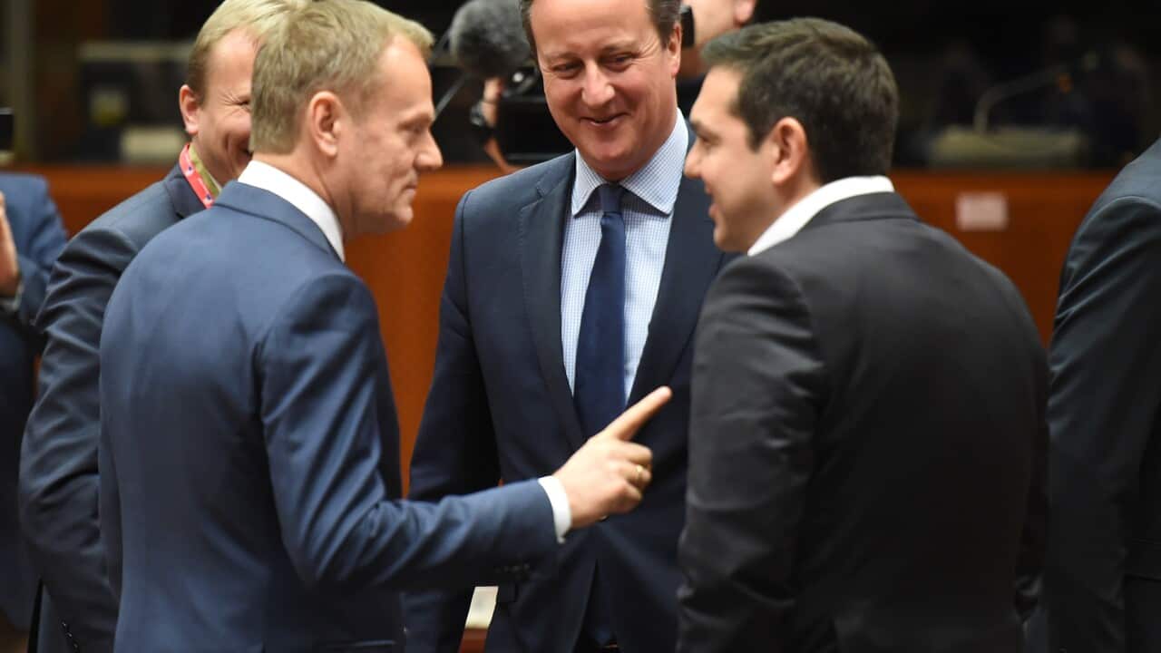British Prime Minister David Cameron, centre, speaks with Greek Prime Minister Alexis Tsipras, right, and European Council President Donald Tusk during a round table meeting at an EU summit in Brussels on Thursday, Feb. 18, 2016.