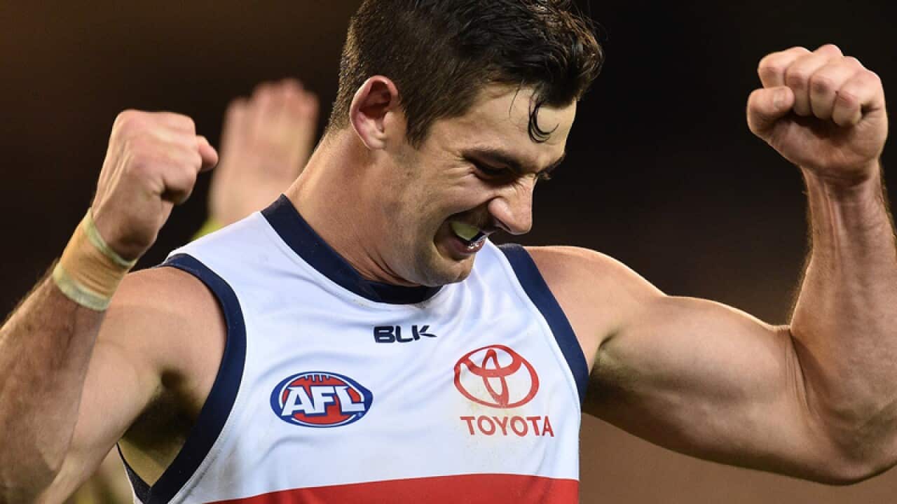 Taylor Walker of the Crows reacts on the final siren