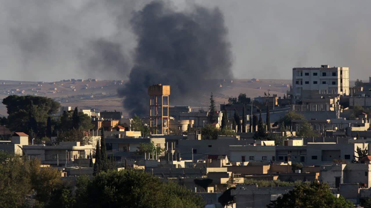 Smokes rise in the south of Syrian Kurdish town of Kobani