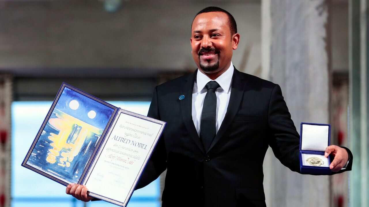 Ethiopia's Prime Minister Abiy Ahmed poses for the media after receiving the Nobel Peace Prize during the award ceremony in Oslo City Hall, Norway, Tuesday Dec. 10, 2019. (HÃ¥kon Mosvold Larsen/NTB Scanpix via AP)