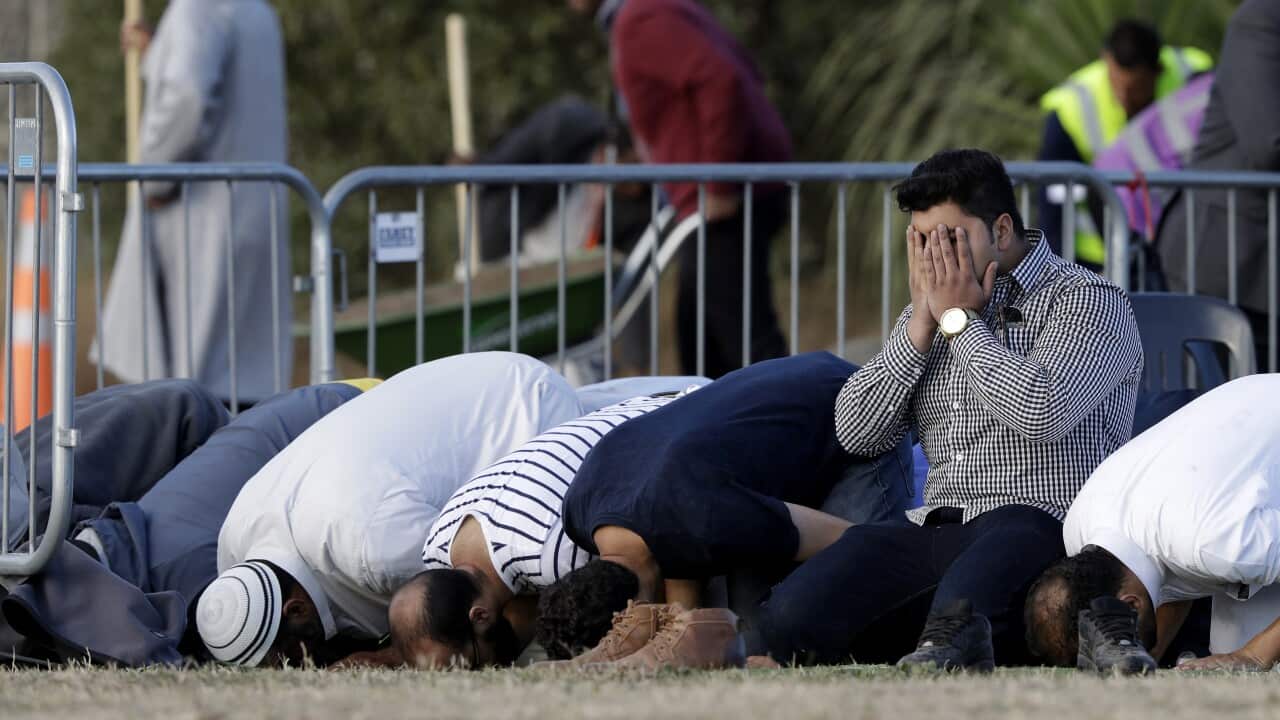 Mourners at a burial ceremony in Christchurch