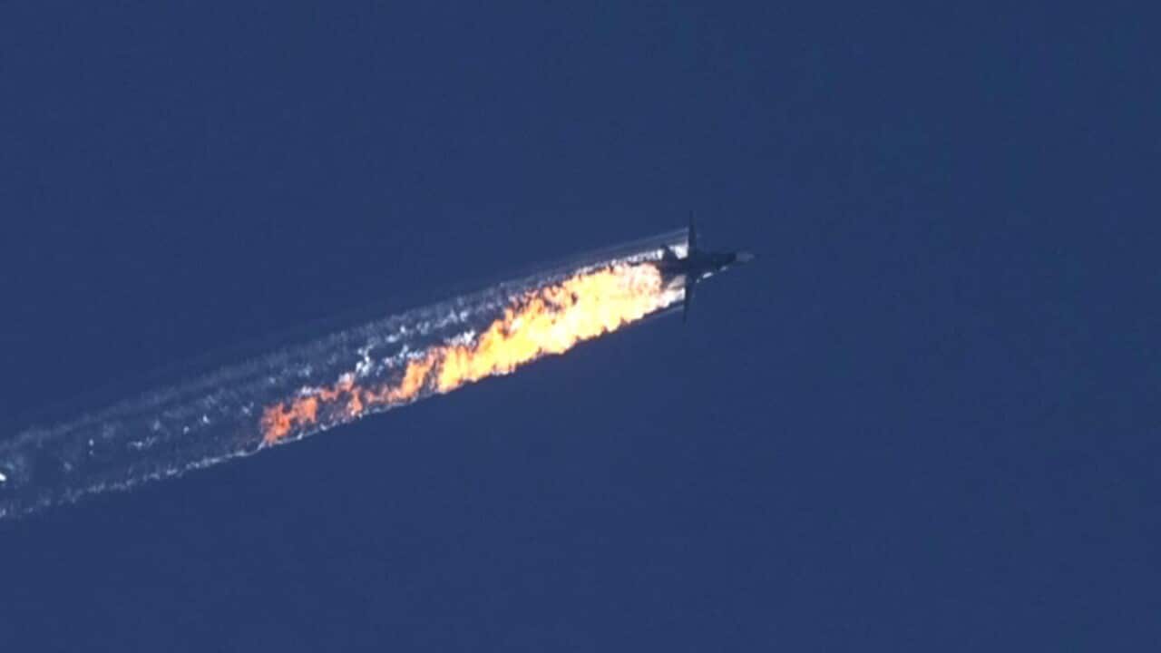 A still image made available on 24 November 2015 from video footage shown by the HaberTurk TV Channel shows a burning trail as a plane comes down after being shot down near the Turkish-Syrian border, over north Syria, 24 November 2015.