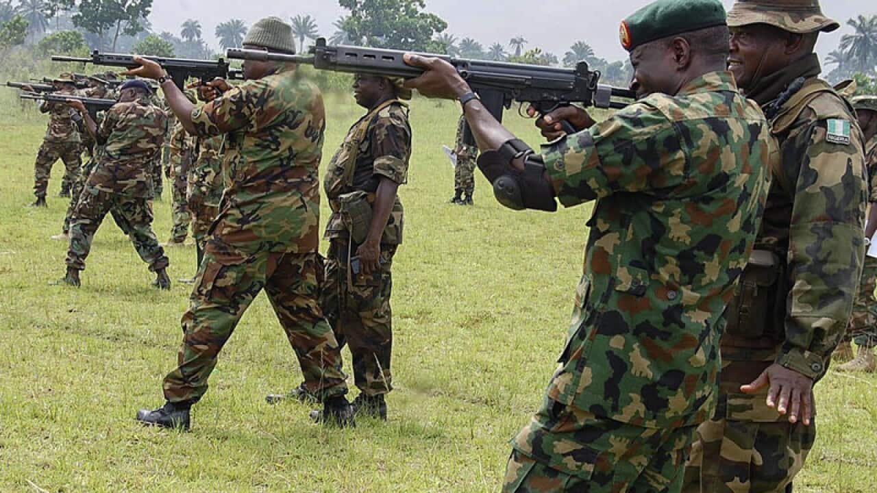 Nigerian army troops practice shooting