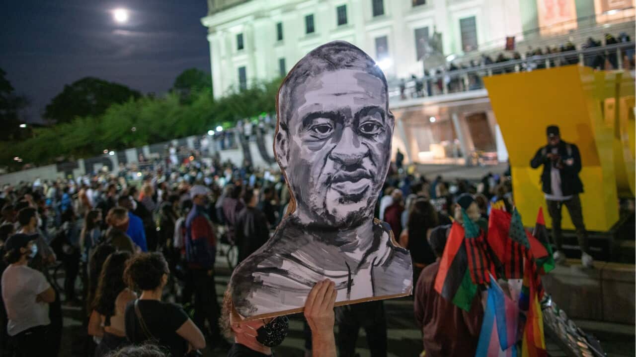 A picture of George Floyd held at a protest.