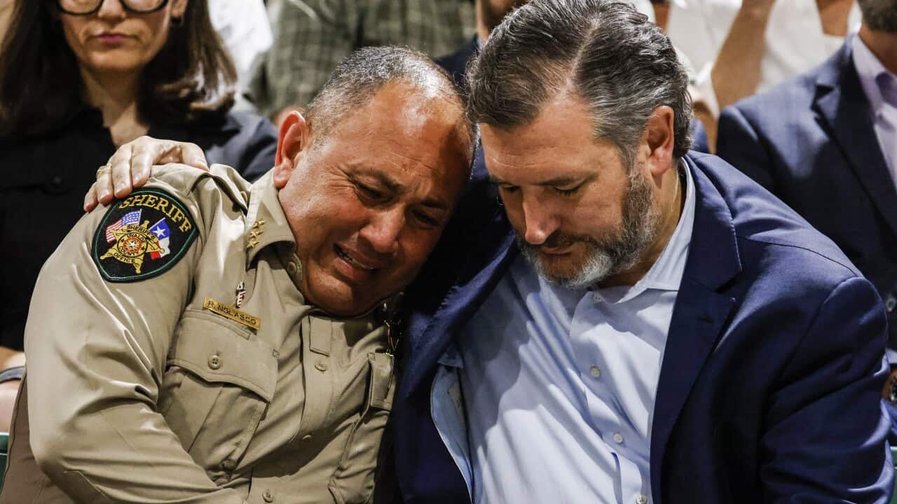 Uvalde County Sheriff Ruben Nolasco (L) cries, as he is comforted by US Senator Ted Cruz