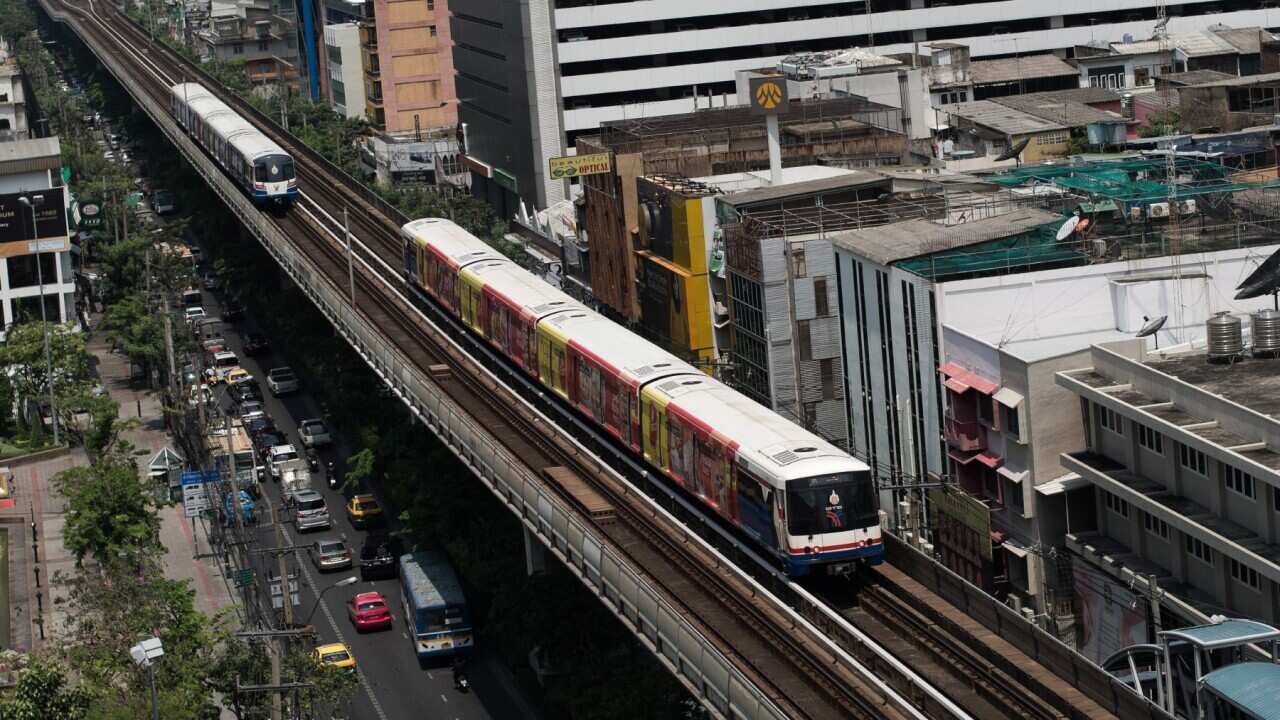 A BTS train (sky train) drive along a railway track in Bangkok on March 20, 2013 (NICOLAS ASFOURI - AFP via Getty Images)