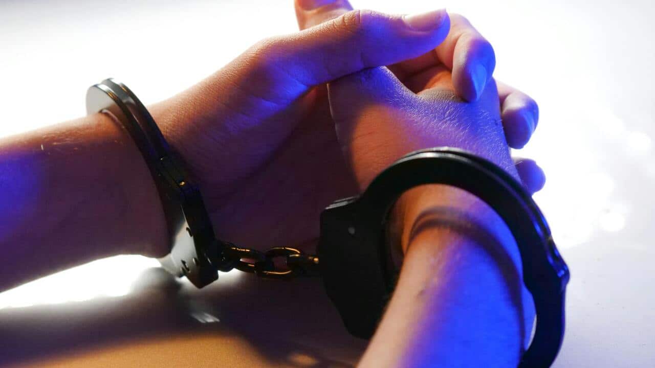 a person with handcuffs
