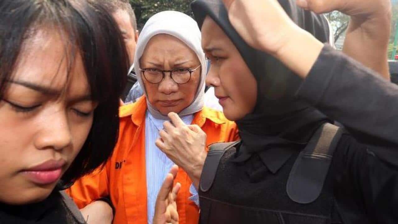 Ratna Sarumpaet (white scarf) detained in relation to hoaxing an assault.