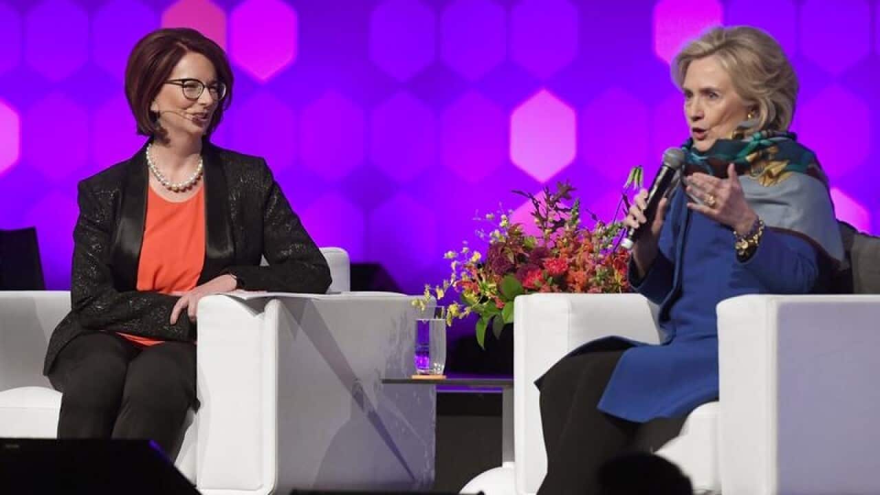 Hillary Clinton speaks with former Australian PM Julia Gillard.