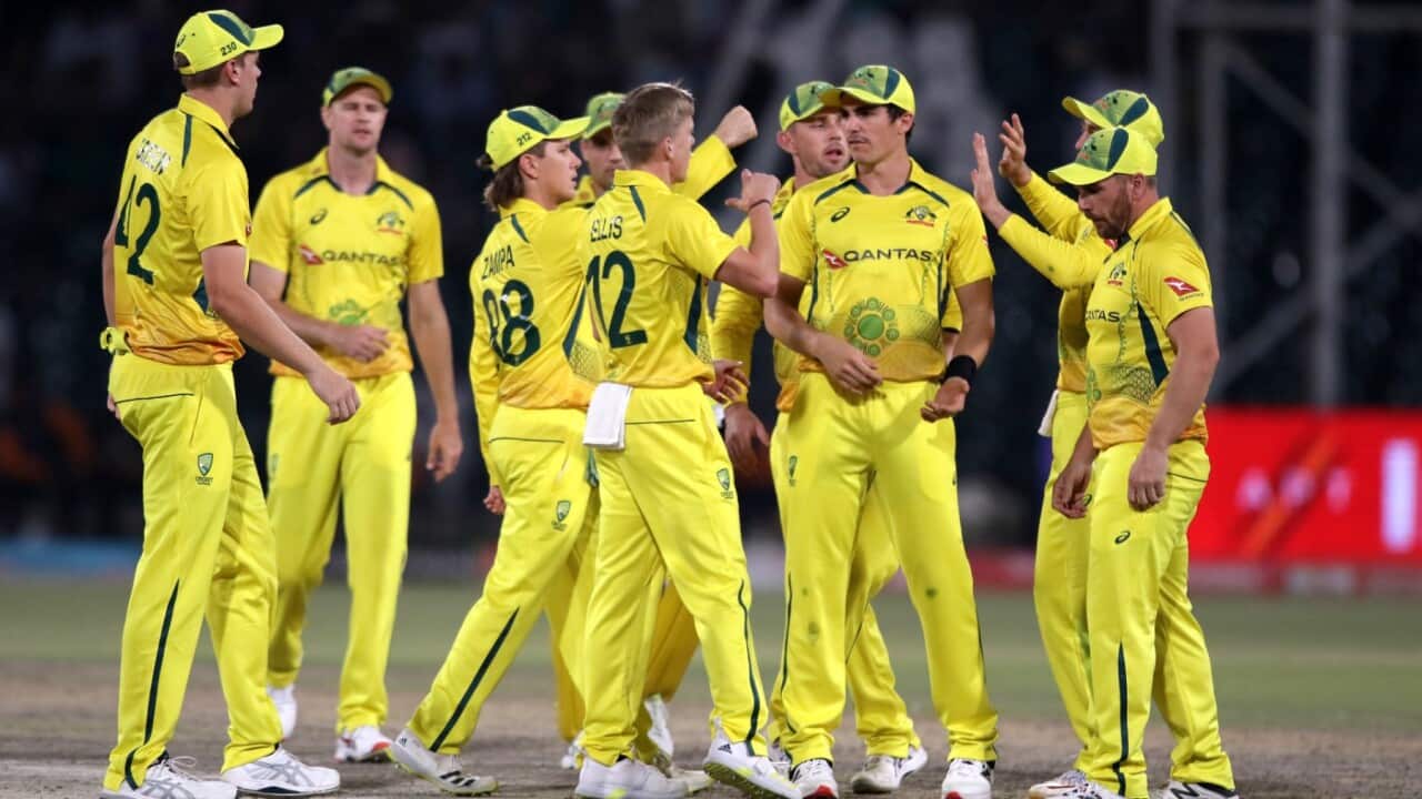 Australian players celebrate after taking a wicket during the third and final One Day International (ODI) cricket match between Pakistan and Australia at the Gaddafi Cricket Stadium in Lahore, Pakistan, 02 April 2022