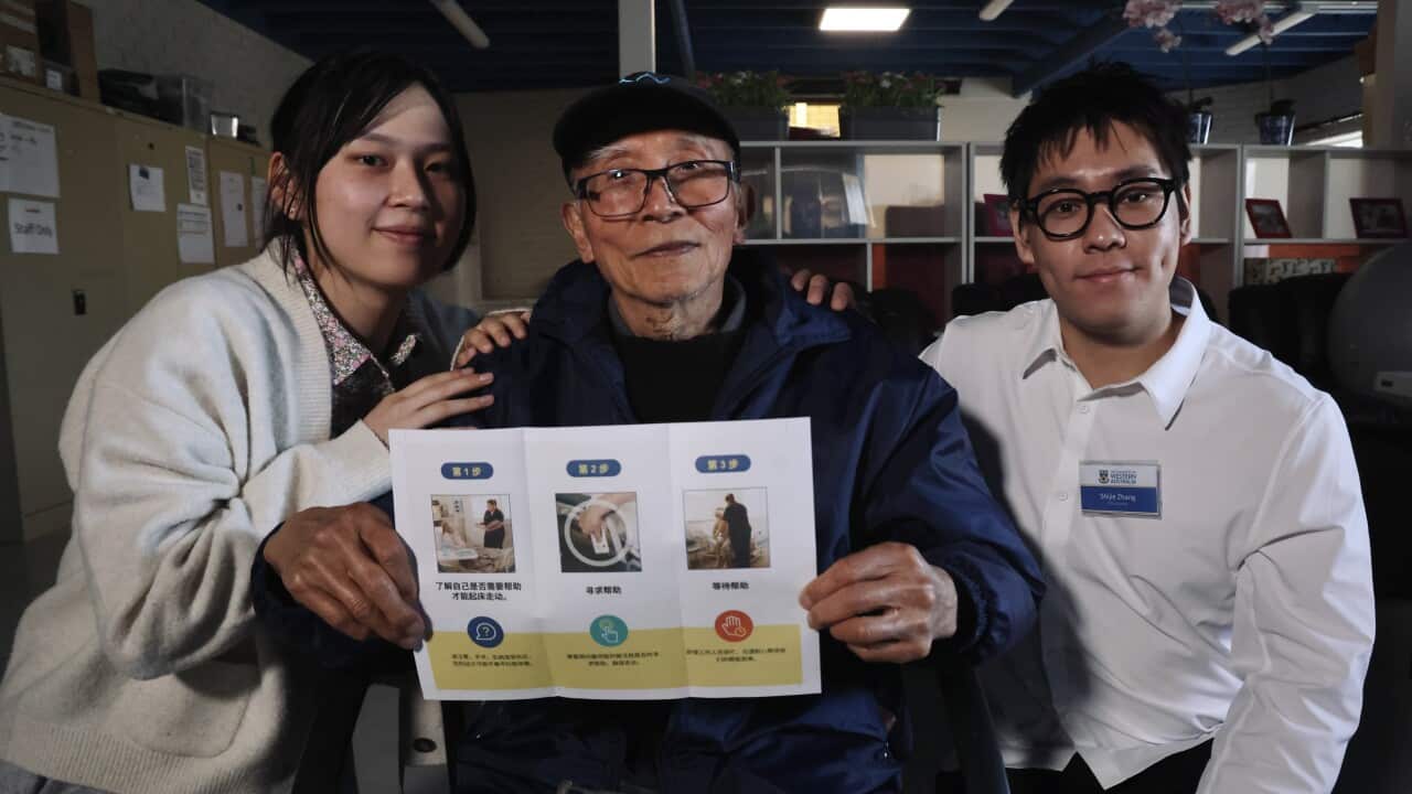 University students Zhou Yuening and Zhang Shijie with elder Liu Xuxiang at a falls prevention workshop in Perth (Christopher Tan SBS).jpg