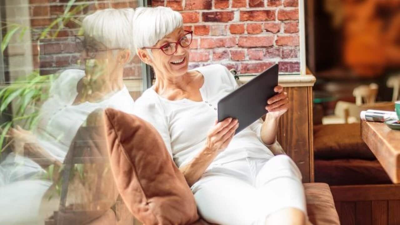 Senior woman with digital tablet