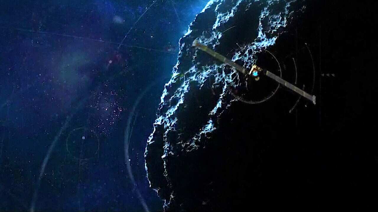 An artist's impression of the DART spacecraft about to hit the asteroid