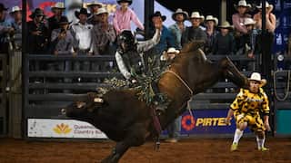 A competitor in action during the open bull ride event at the Mount Isa Mines Rodeo - Getty