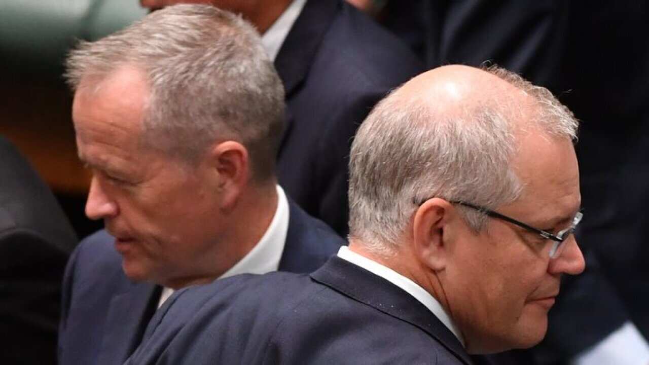 Leader of the Opposition Bill Shorten and Prime Minister Scott Morrison during division in the House of Representatives at Parliament House in Canberra, Thursday, December 6, 2018. (AAP Image/Mick Tsikas) NO ARCHIVING
