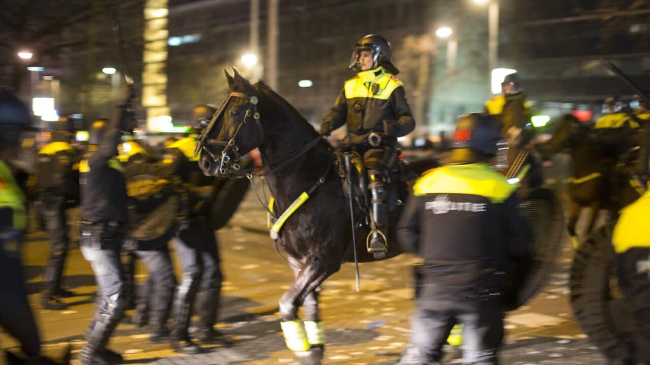 Dutch riot police battle pro Erdogan demonstrators after riots broke out at the Turkish consulate in Rotterdam, Netherlands, Sunday, March 12, 2017.