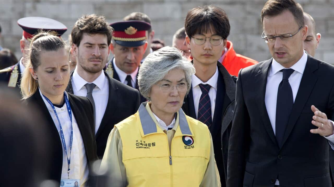 South Korean Foreign minister Kang Kyung-wha and her Hungarian counterpart Peter Szijjarto visit the bank of the Danube river where a sightseeing boat capsized.
