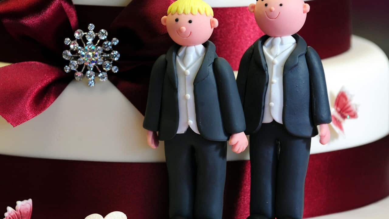 groom cake decorations on a wedding cake