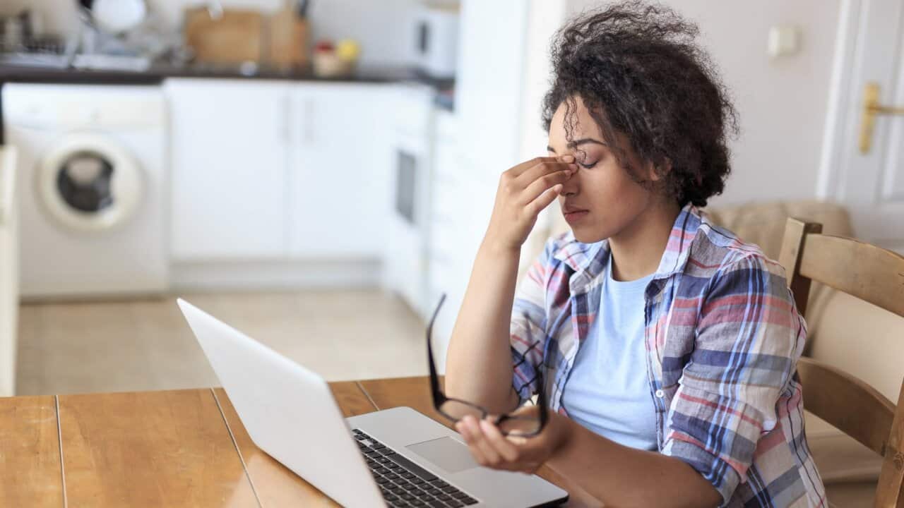 Woman with Laptop having problems
