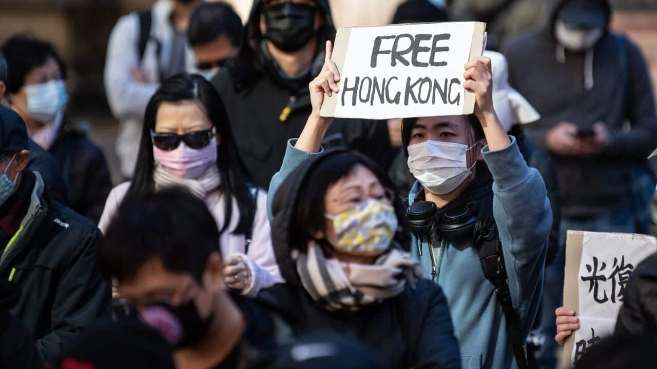 Protestors listen to speakers during a rally to show support to for people in Hong Kong.