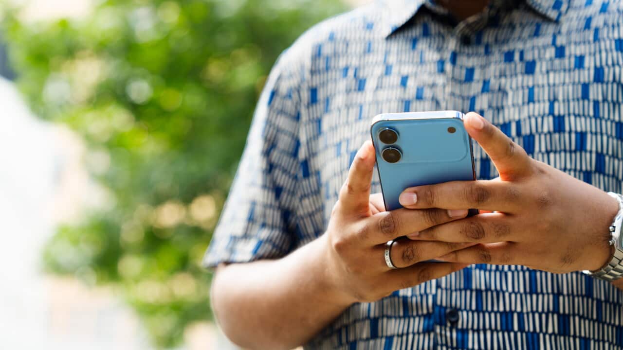 Close up of man using smart phone