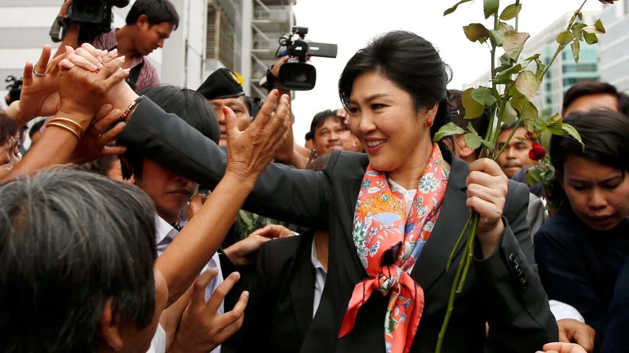 Yingluck Shinawatra greets supporters after she was removed from office - AAP-1.jpg