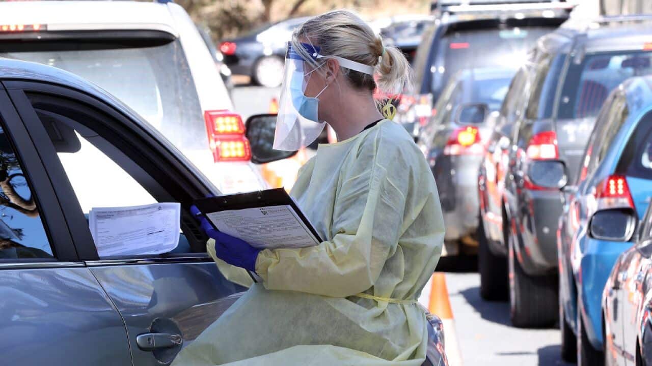 A health worker carries out COVID-19 testing at the Joondalup drive-through clinic on 3 May, 2021 in Perth.