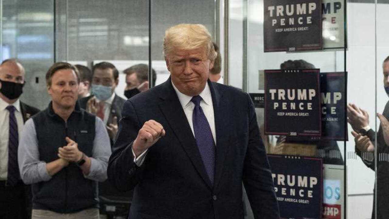 President Donald Trump arrives to speak at the Trump campaign headquarters on Election Day.