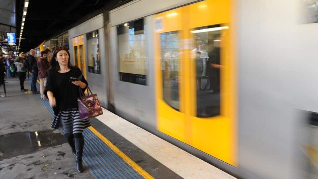 Passengers board a train at Circular Quay in Sydney
