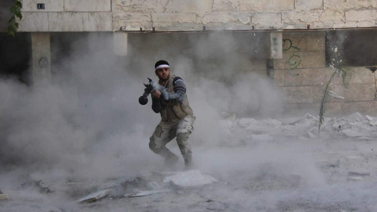 A rebel Syrian fighter firing an rocket propelled grenade - AAP-1.jpg