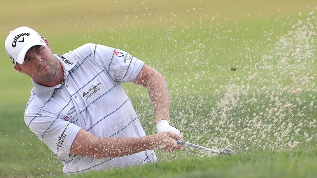Marc Leishman of Australia hits from a bunker