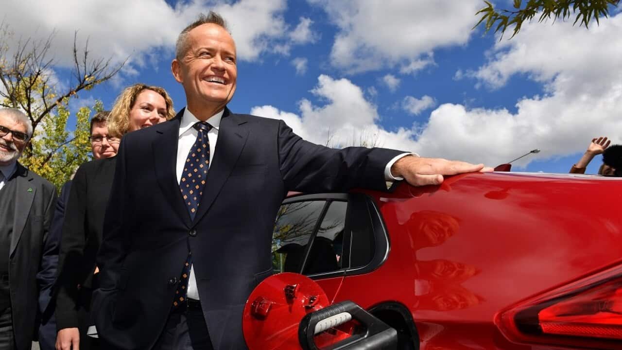 Leader of the Opposition Bill Shorten charges an electric car after launching Labor's Climate Change Action Plan at the Actewagl Electric Car Charging Station in Canberra, Monday, April 1, 2019. (AAP Image/Mick Tsikas) NO ARCHIVING