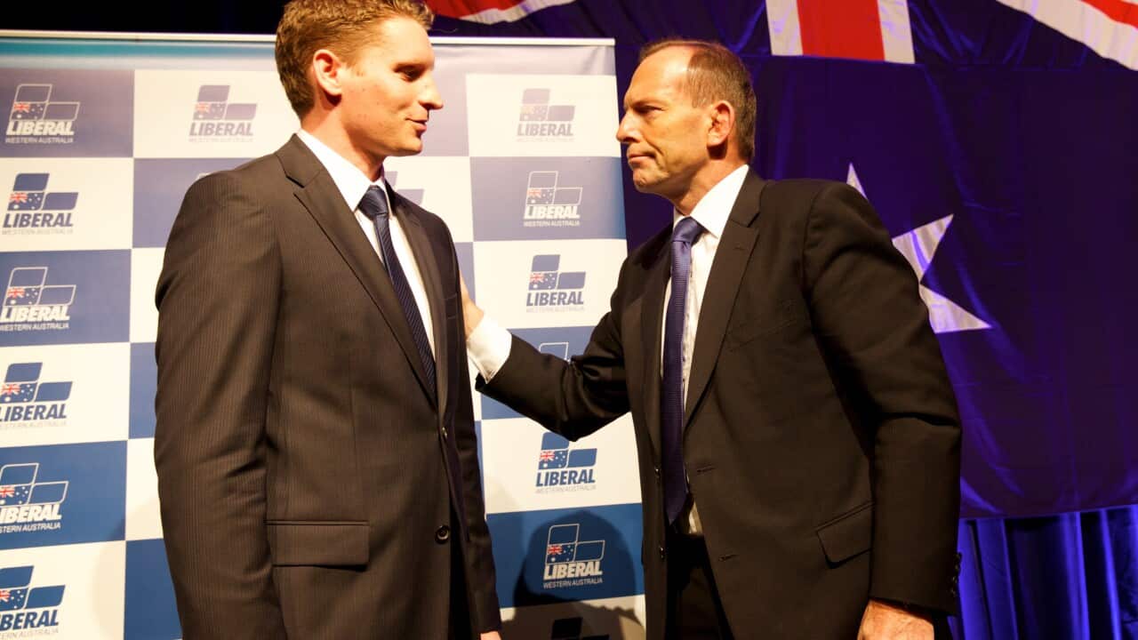 Andrew Hastie, the Liberal candidate for the upcoming Canning by-election is congratulated by Australian Prime Minister Tony Abbott after speaking at the West Australian Liberal Party Annual State Conference at the Hyatt Regency Hotel in Perth