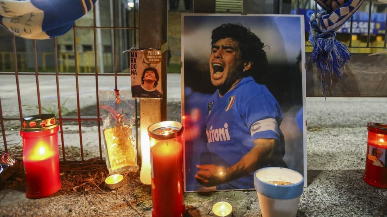 Outside the San Paolo stadium in Naples, people gather to pay homage to the Diego Armando Maradona.