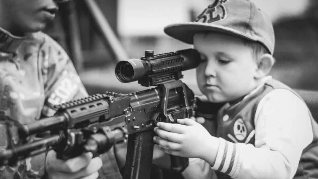 Child using gun