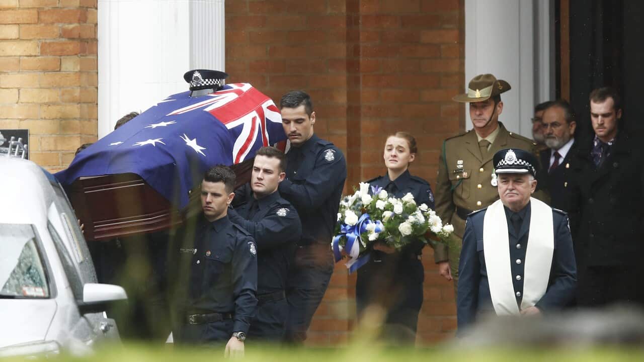 The coffin is carried to the hearse at the funeral of Constable Glen Humphris at the Victoria Police Academy in Melbourne.